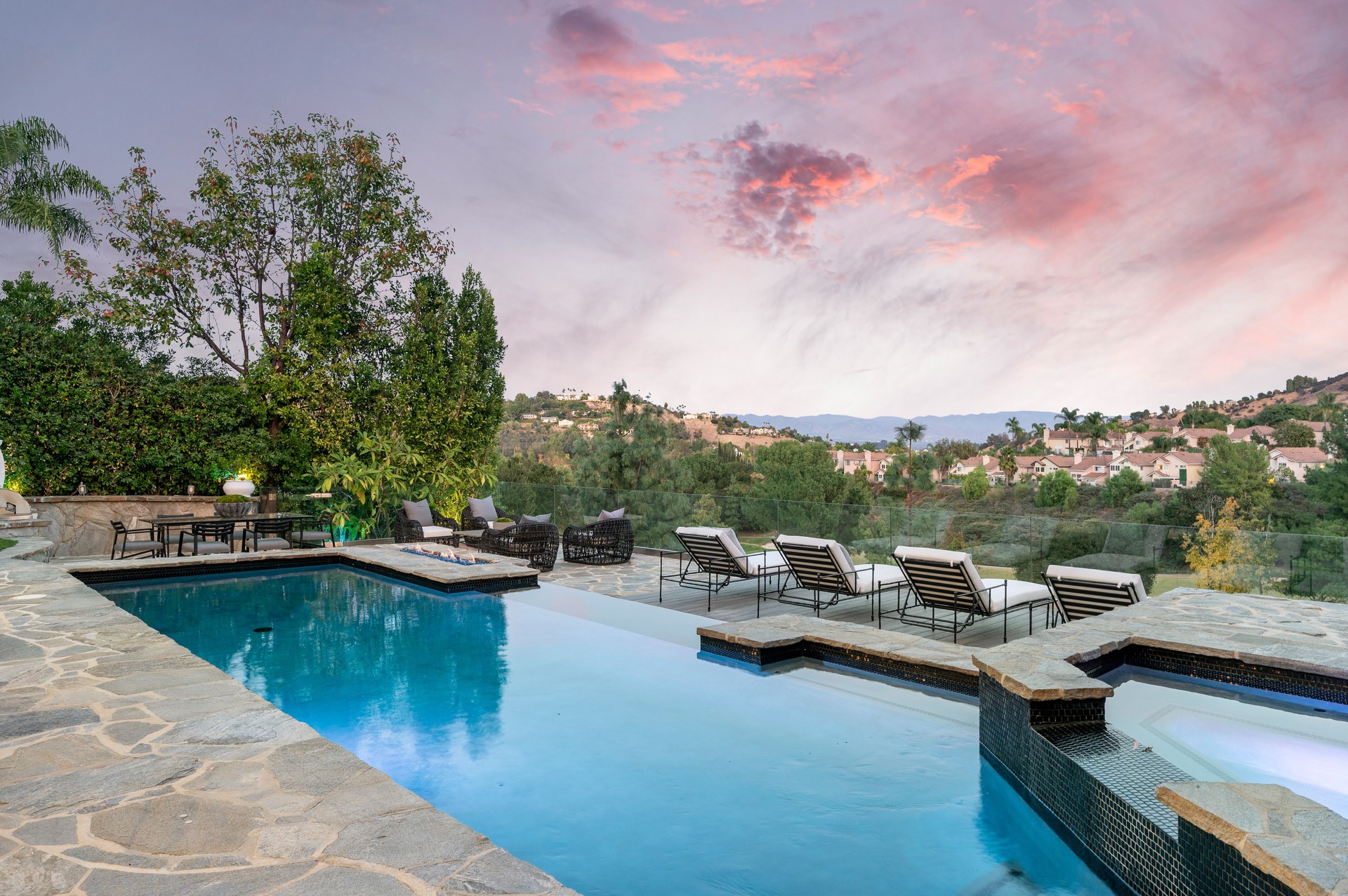 Swimming pool on a patio with a stunning sky backdrop